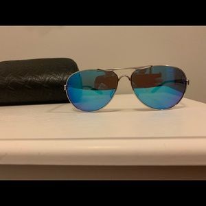 Ladies Oakley Feedback sunglasses. Silver frame with blue polarized lenses.